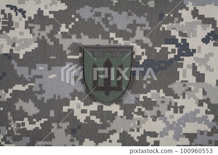 KYIV, UKRAINE - October 6, 2022. Russian invasion in Ukraine 2022. Territorial Defence Forces of Ukraine uniform insignia badge. KYIV, UKRAINE - October 6, 2022. Russian invasion in Ukraine 2022. Territorial Defence Forces of Ukraine uniform insignia badge. 100960553