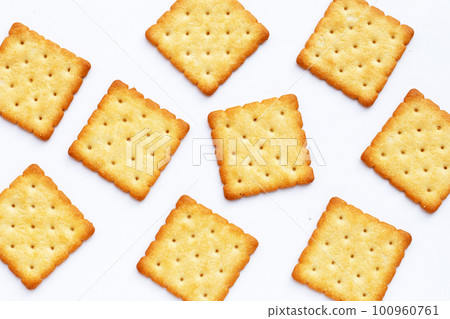 Dry cracker cookies on white background. 100960761