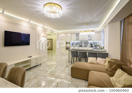 Studio apartment featuring classic kitchen with island, and wall-mounted TV set Studio apartment featuring classic kitchen with island, and wall-mounted TV set 100960960