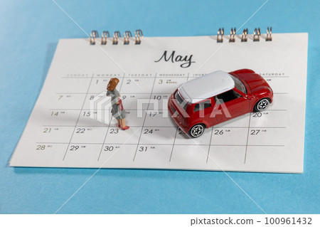 Miniature cars and people Calendar for May 100961432