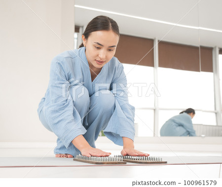 Asian woman folded her palms on sadhu boards.  100961579