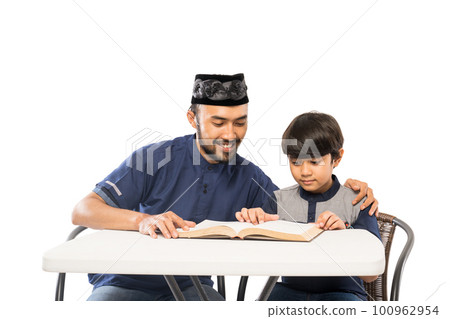 happy asian father and son read quran together 100962954