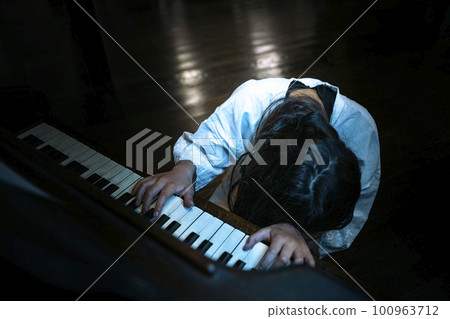 School ghost playing the piano in the music room Psychic phenomenon 100963712