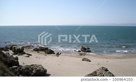 Calm blue sea, white sandy beach and Sado Island in spring 100964103