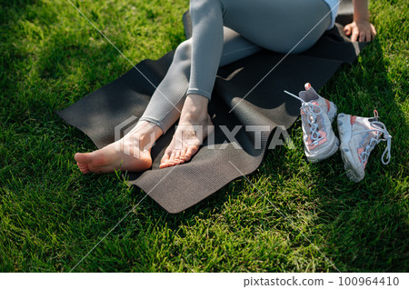 Romantic girl with hat on picnic in park Romantic girl with hat on picnic in park 100964410