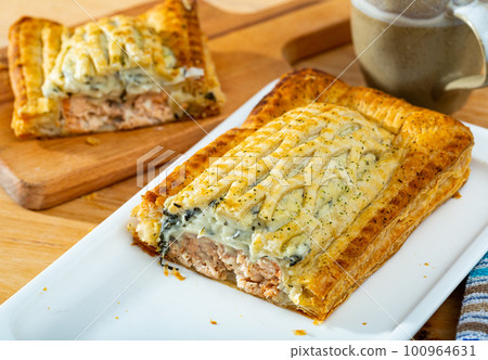 Traditional salmon in puff pastry 100964631