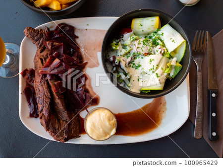 Popular dish of French cuisine is a bookmark with shallots 100965429