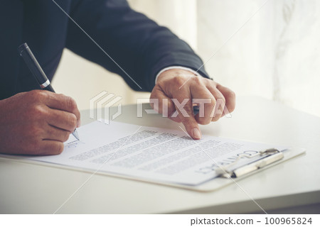 Asian business man using pen signing on new contract to starting projects in conference room. Close up manager businessman hands sign contract working meeting. Business agreement concepts. Asian business man using pen signing on new contract to starting projects in conference room. Close up manager businessman hands sign contract working meeting. Business agreement concepts. 100965824