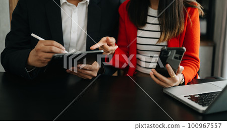 Business team meeting. professional investor working new start up project. Finance task. with smart phone and laptop and digital tablet computer  in morning light.Business team meeting. professional 100967557
