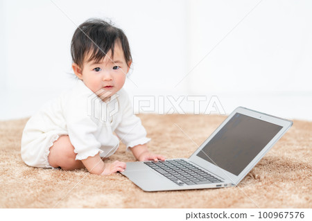 baby playing with computer baby playing with computer 100967576