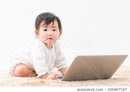 baby playing with computer baby playing with computer 100967587