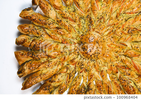 Sun recipe in puff pastry with smoked salmon and boursin cheese Sun recipe in puff pastry with smoked salmon and boursin cheese 100968404