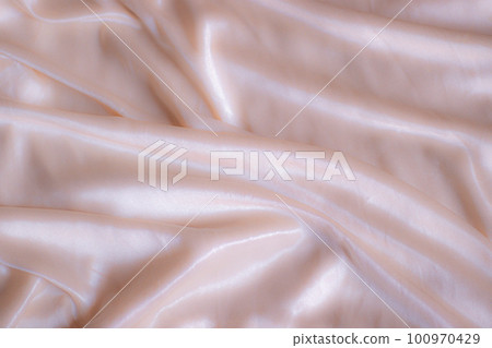 Elegant vintage themed silk beige colored background Elegant vintage themed silk beige colored background 100970429