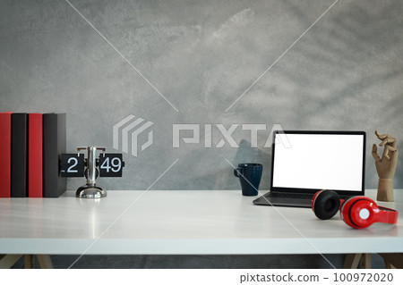 Laptop computer, wireless headphone, vintage flip clock and books on white table against loft wall Laptop computer, wireless headphone, vintage flip clock and books on white table against loft wall 100972020
