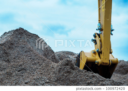 Photo of excavator digging soil Photo of excavator digging soil 100972420