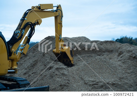 Photo of excavator digging soil Photo of excavator digging soil 100972421