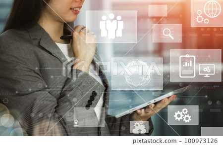 futuristic technology and online data storage for business network concept. businesswoman using tablet connects to internet server service presented in white digital graphic interface. futuristic technology and online data storage for business network concept. businesswoman using tablet connects to internet server service presented in white digital graphic interface. 100973126