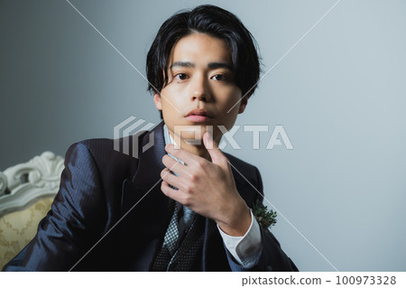 Male groom in a tuxedo 100973328