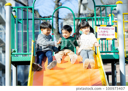 Children playing with playground equipment Park 100973407