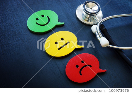 Stethoscope and emoji as a symbol of evaluation. Patient experience concept. 100973976