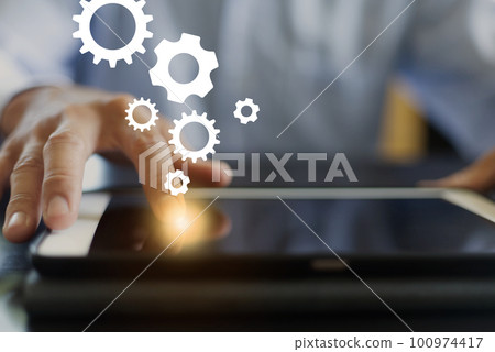 cog wheels, gears and hand clicking 100974417