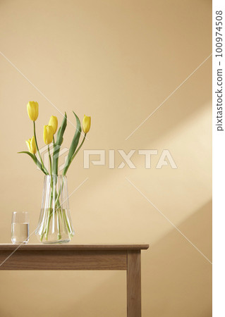 A cozy home with sunlight shining through the windows and fresh flowers A cozy home with sunlight shining through the windows and fresh flowers 100974508