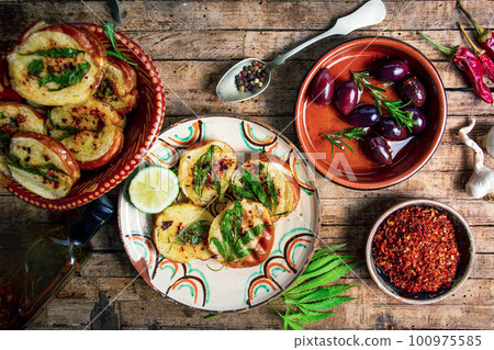 Homemade bruschetta with marijuana and natural ingredients Homemade bruschetta with marijuana and natural ingredients 100975585