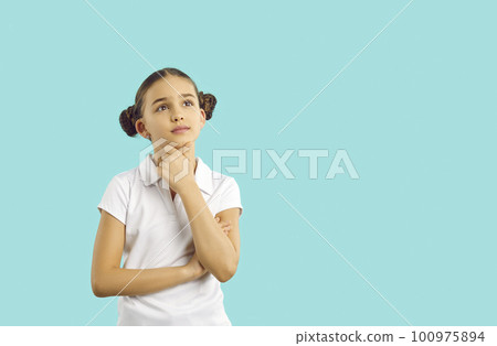 Preteen girl imagining, thinking, making decision or coming up with plan on light blue background. 100975894