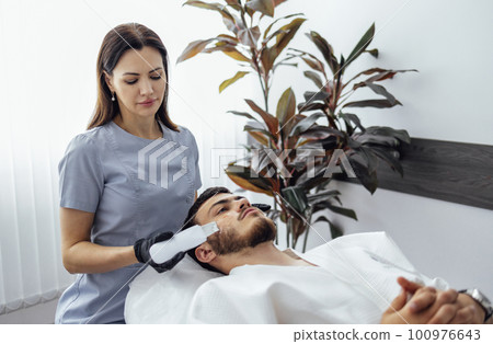 Young beautiful caucasian woman doing an effective cleansing of the skin Young beautiful caucasian woman doing an effective cleansing of the skin 100976643