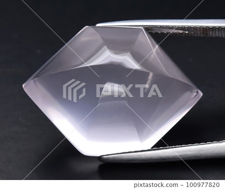 Natural gemstone rose quartz on gray background Natural gemstone rose quartz on gray background 100977820