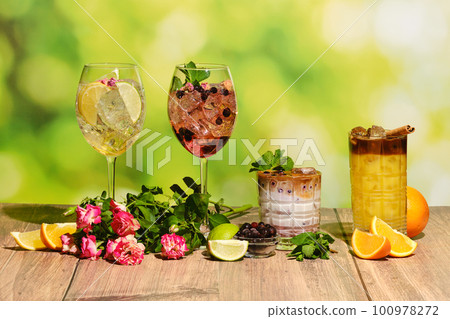 Set of cold refreshing summer drinks on wooden table Set of cold refreshing summer drinks on wooden table 100978272