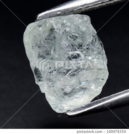 Natural gemstone green beryl on black background 100978350