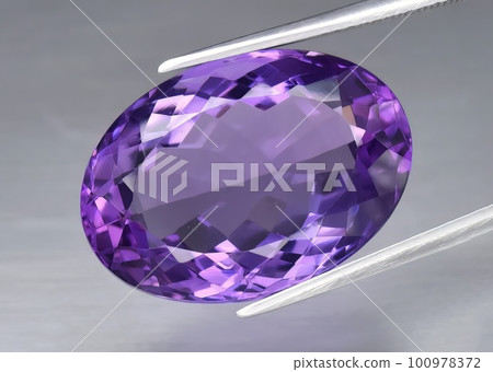Natural gemstone green amethyst on gray background 100978372