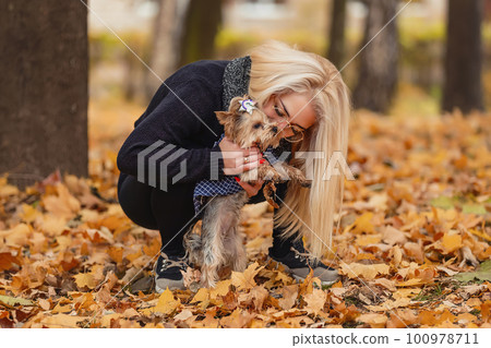 girl with her little dog 100978711