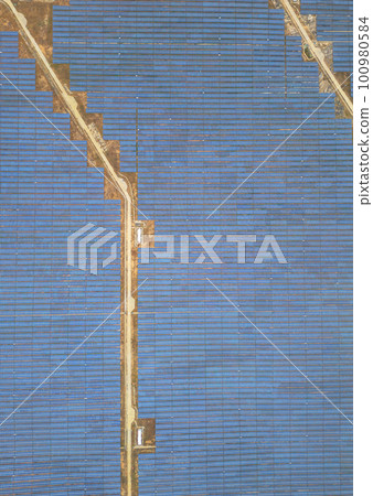 Solar cell panels at solar farm, drone view. Green energy concept. Solar cell panels at solar farm, drone view. Green energy concept. 100980584