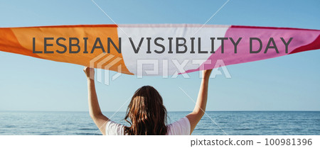text lesbian visibility day and lesbian pride flag 100981396