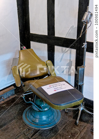 An old dentist chair at Tudor House Museum Worcester - United Kingdom An old dentist chair at Tudor House Museum Worcester - United Kingdom 100981494
