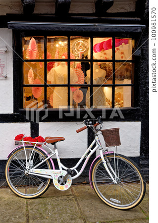 Bike parked in front of a store in Worcester - United Kingdom Bike parked in front of a store in Worcester - United Kingdom 100981570