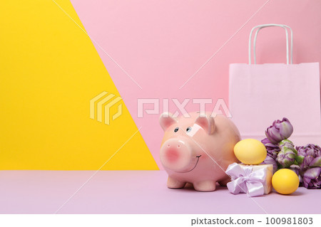 Concept of saving money for easter holidays, space for text Concept of saving money for easter holidays, space for text 100981803