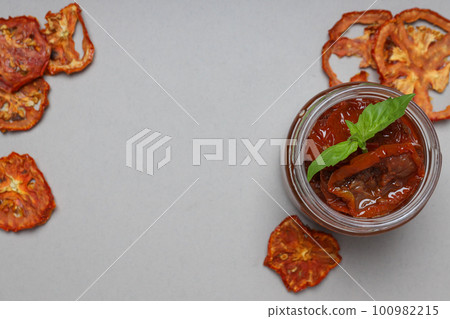 Concept of tasty food - delicious dried tomato 100982215
