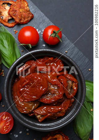 Concept of tasty food - delicious dried tomato 100982216