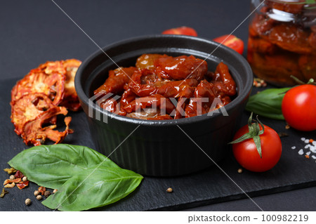 Concept of tasty food - delicious dried tomato 100982219