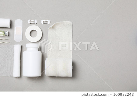 First aid kit supplies on gray background First aid kit supplies on gray background 100982248