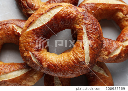 Concept of tasty food - bagel, tasty bakery products Concept of tasty food - bagel, tasty bakery products 100982569