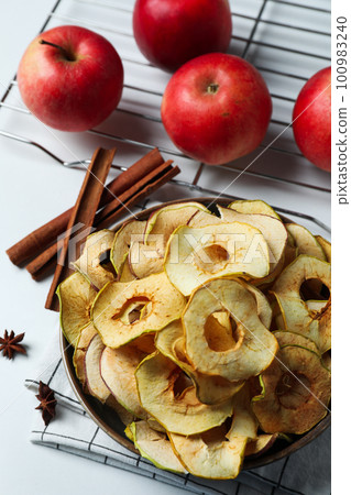 Concept of tasty food, dried apple chips Concept of tasty food, dried apple chips 100983240
