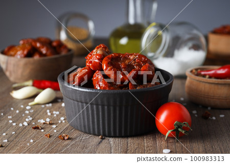 Concept of tasty food - sun-dried tomato 100983313