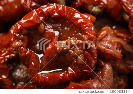 Concept of tasty food - sun-dried tomato 100983314