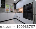 A recently renovated kitchen with sleek, modern appliances 100983757