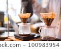 clerk serving coffee 100983954
