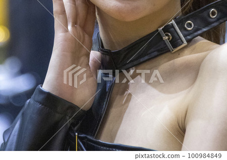 Young woman's chest with hand on cheek Young woman's chest with hand on cheek 100984849